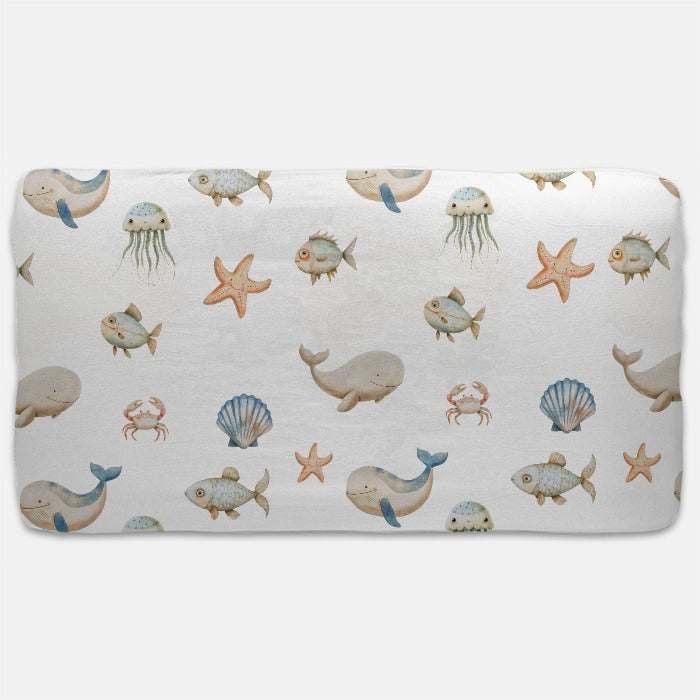 Wrap your little one in the cozy embrace of the Ocean Breeze Jersey Fitted Crib Sheet, designed to offer the ultimate comfort and warmth, reminiscent of your favorit