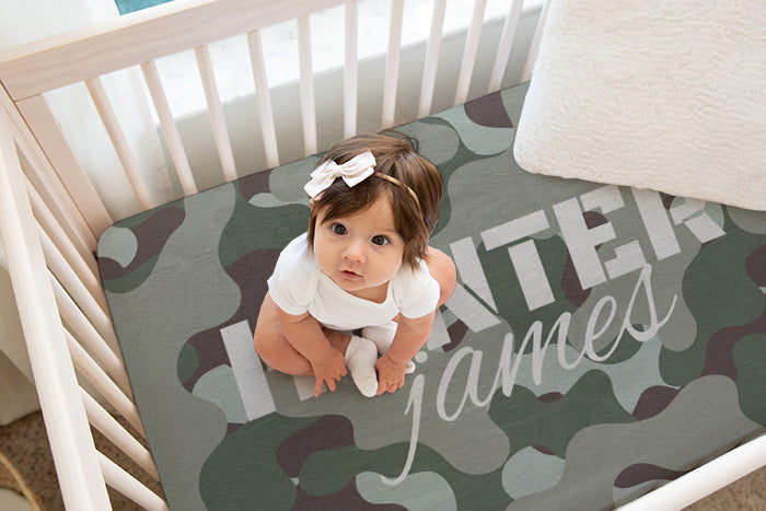 Eco-friendly and gentle on baby's skin, this camo crib sheet combines functionality with a playful military-inspired motif, making it an ideal choice for modern, themed nurseries.