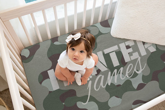 Eco-friendly and gentle on baby's skin, this camo crib sheet combines functionality with a playful military-inspired motif, making it an ideal choice for modern, themed nurseries.