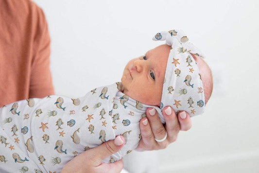 The Ocean Breeze Baby Headband, the perfect blend of style and comfort for your little fashionista. This chic accessory is an essential addition to every trendy baby